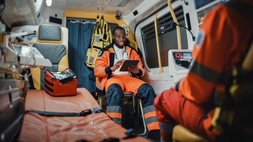 African American Paramedic Using Tablet in an Ambulance