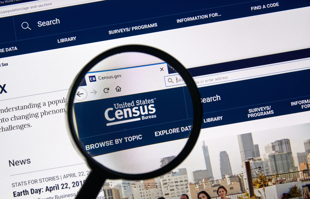 Webpage with a magnifying glass showing the US Census website